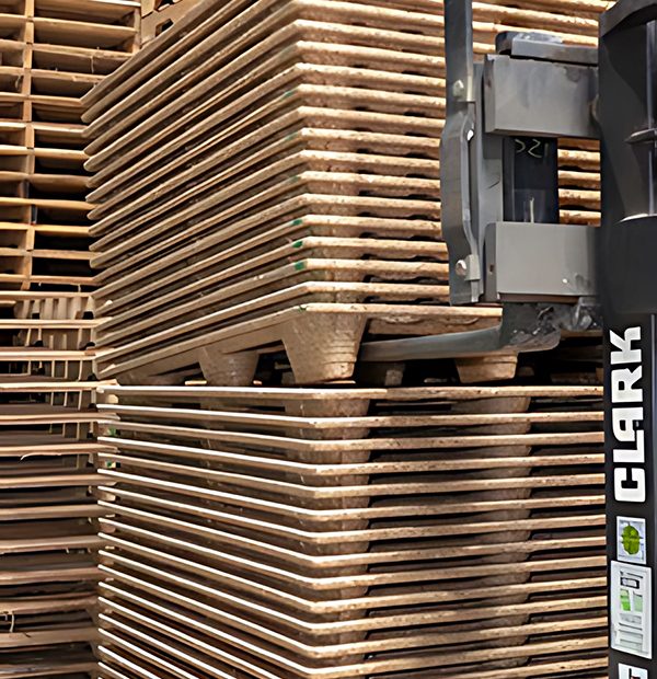 Forklift pallet handling | Stack of nestable pallets being moved | Reliable and stable lifting in warehouse
