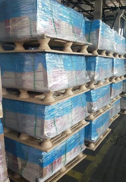 High-density storage | Multiple goods stacked on presswood pallets | Maximizing warehouse vertical space