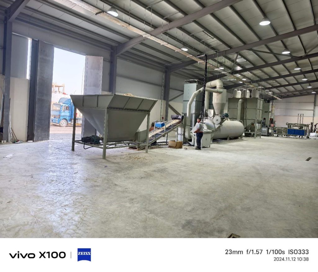 Material preparation area | Wood chip dryer and conveyor system | Essential processing stage in pallet production
