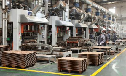 Low-angle shot of stacked pressed wood pallets ID-2995 | High stacking capacity optimizes warehouse space utilization