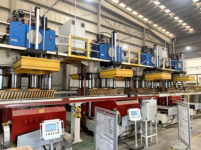 Wood pallet making machine production line: automated presswood pallet segment with rail-mounted sawdust spreading machines and central PLC screens.