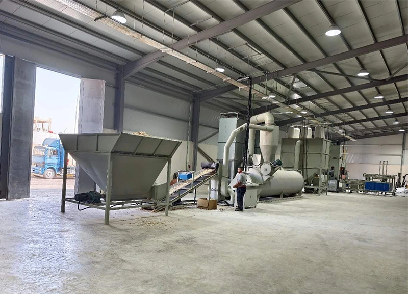 High-capacity wood shavings pretreatment plant featuring automatic feeding hopper, belt conveyor, and rotary drum dryer