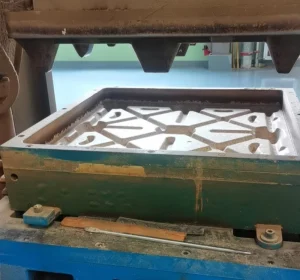 Closeup of an open steel mold cavity with structural ribs, showing AutoML presswood pallet machine tooling for a smooth nail-free wooden pallet process in warehouse Zero Harm handling.