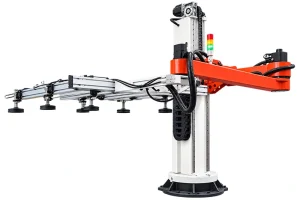 Industrial vacuum handling robot with long articulated arm, suction cups, cable chain, and stack light