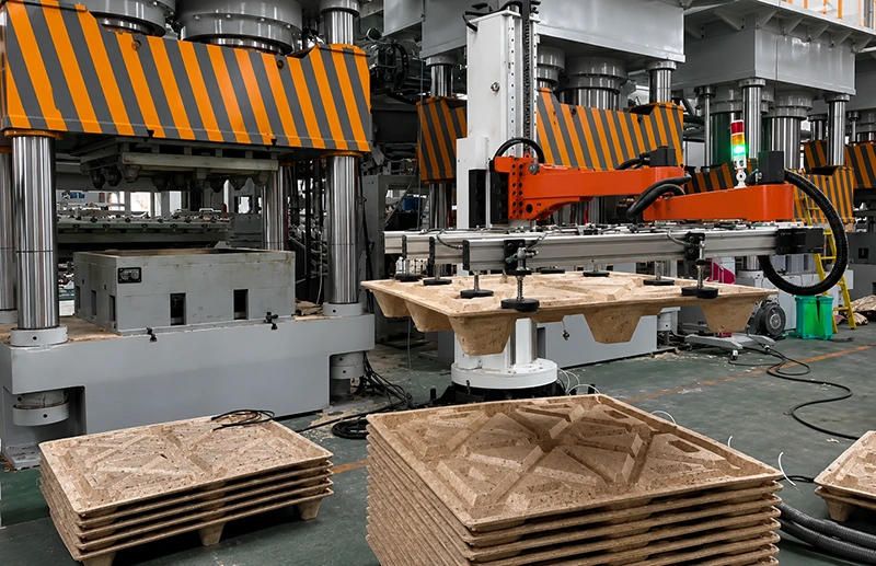 Four-post hydraulic press with robotic vacuum gripper and stacked wooden molding panels