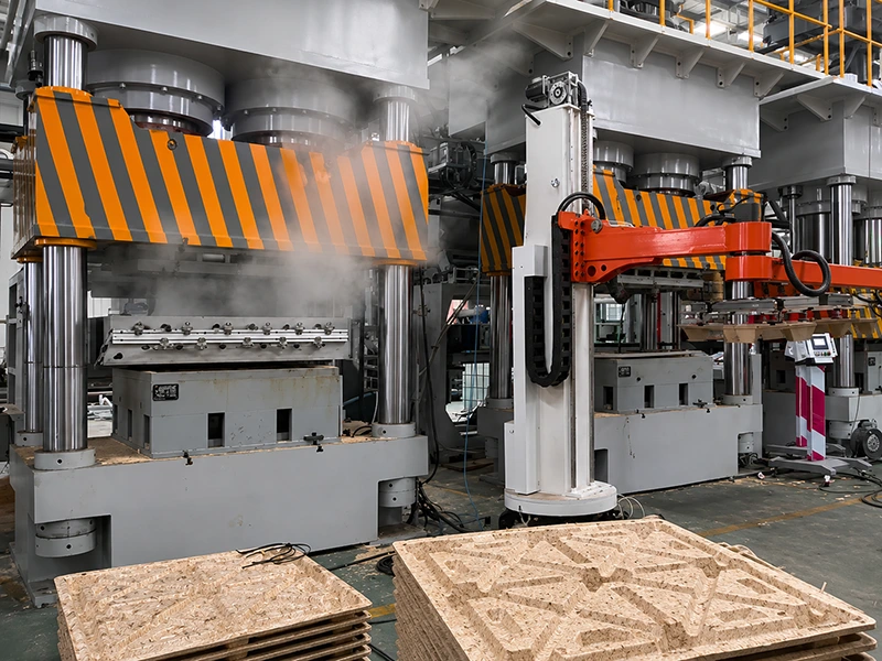 Industrial hydraulic hot press line with robotic loading arm for automated wood panel production