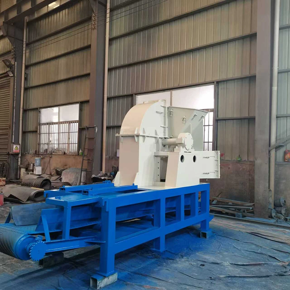 Stationary wood chipper — welded support frame, floor-mounting legs and enclosed rotor housing Stationary wood chipper on a welded steel support frame with floor-mounting legs, drive end and enclosed rotor housing