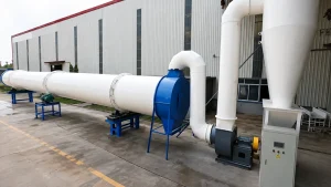 Industrial rotary drum dryer with cyclone separator, process ducting, blower, and steel support frames