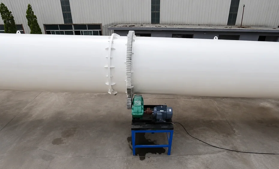White horizontal 17 to 18 m rotary drum dryer shell with external girth gear, pinion drive, gearbox and motor for continuous Malaysia monsoon duty