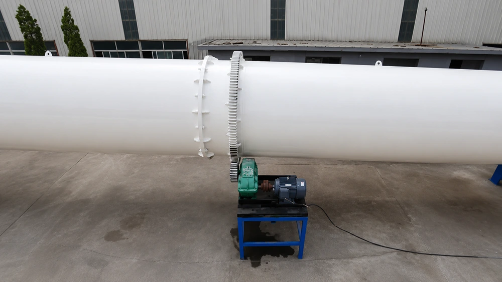 White horizontal 17 to 18 m rotary drum dryer shell with external girth gear, pinion drive, gearbox and motor for continuous Malaysia monsoon duty