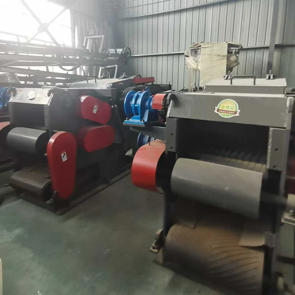 Emp-Shred industrial roller shredder with twin horizontal rollers, red belt guards, blue drive pulley, and steel housing