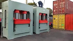 AutoML presswood pallet machine hydraulic press structures prepared for an ISPM-15 exempt molded pallet production line.