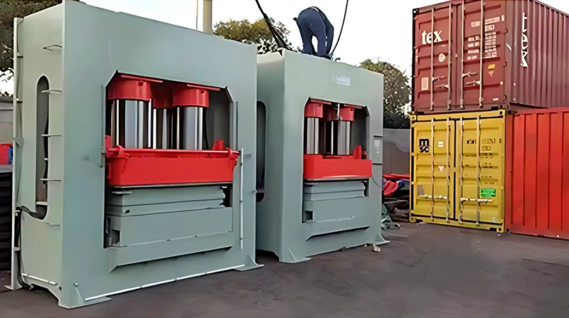 AutoML presswood pallet machine hydraulic press structures prepared for an ISPM-15 exempt molded pallet production line.