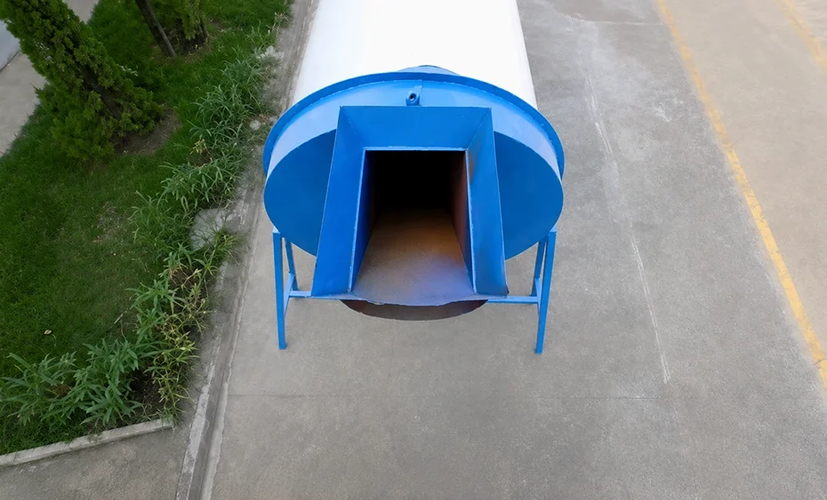 Blue cylindrical drying unit with rectangular front chute, curved guard panels, and steel support legs