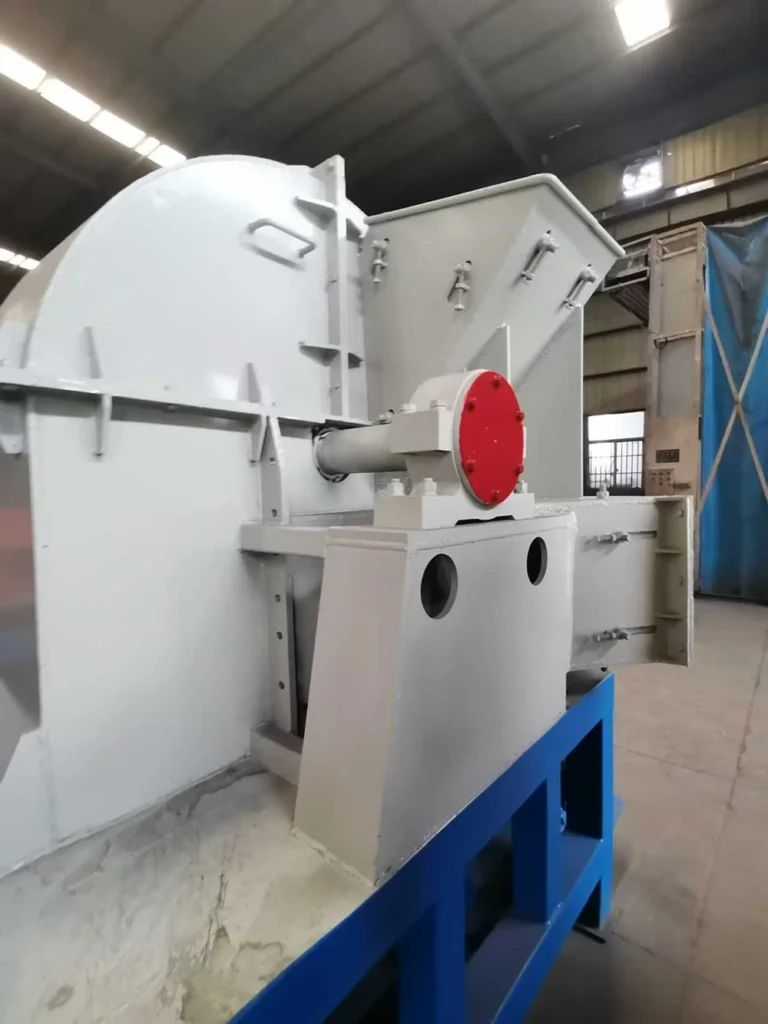 EMP-Shred industrial shredder housing with enclosed drive shaft, red drive-end cover, hinged panels, and steel frame