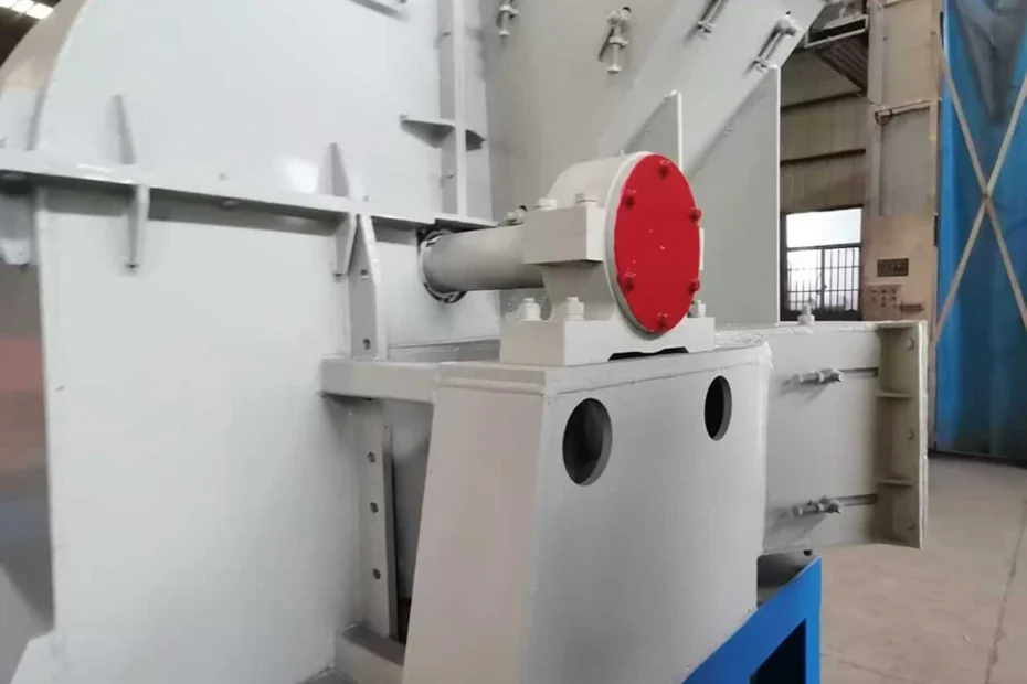 EMP-Shred industrial shredder housing with enclosed drive shaft, red drive-end cover, hinged panels, and steel frame