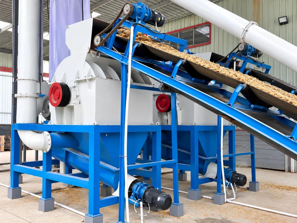 PULVZ wood pulverizer machine with inclined belt conveyor feeding wood chips into crushing chamber on blue steel frame